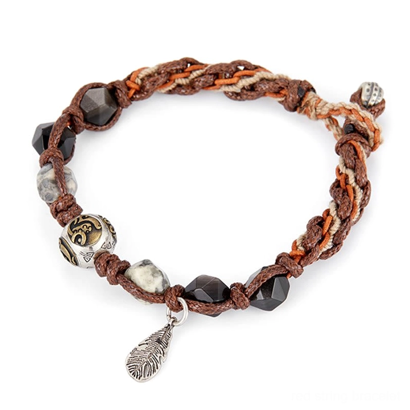 natural silver sheen obsidian bead close up on red string bracelet