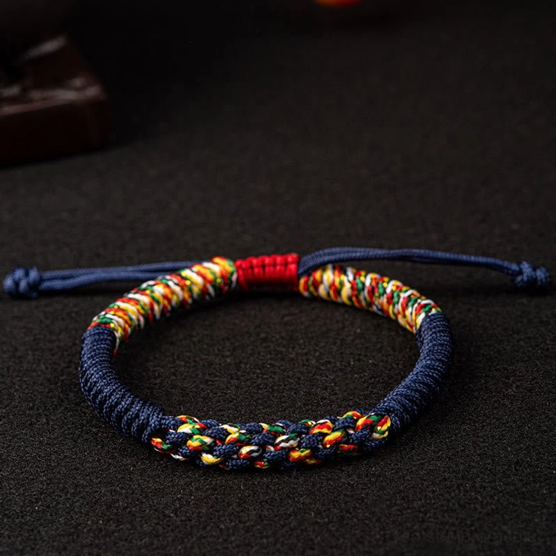 Navy blue Tibetan King Kong Knot bracelet with multicolor woven accent and blue adjustable straps