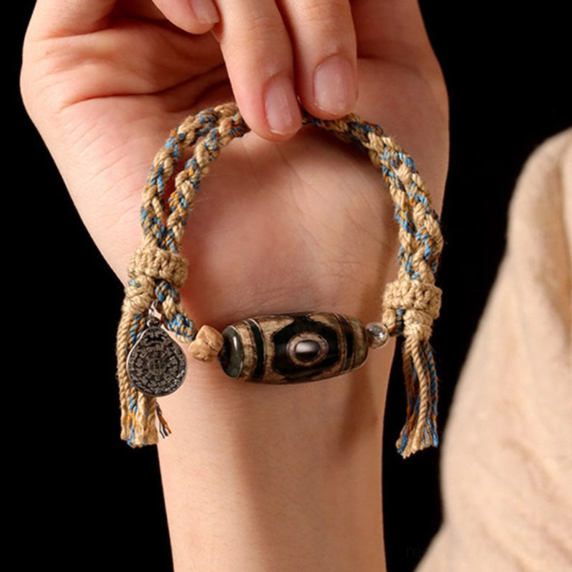 Nine-Eye Dzi Bead bracelet cosmic protection wealth prosperity symbol