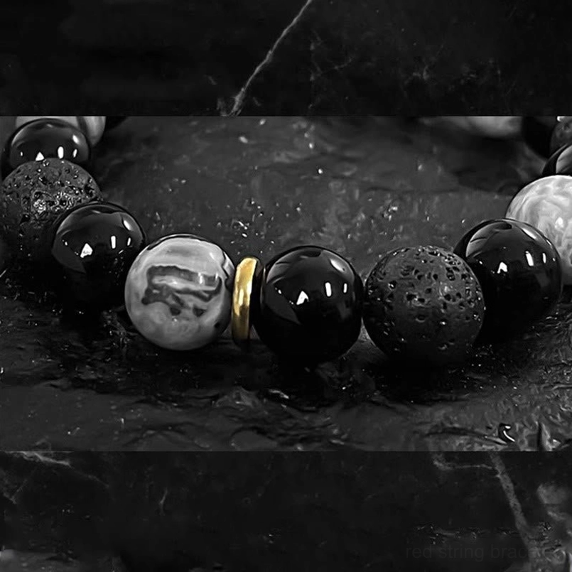 Black obsidian lava rock bracelet bead close up view showing stone texture