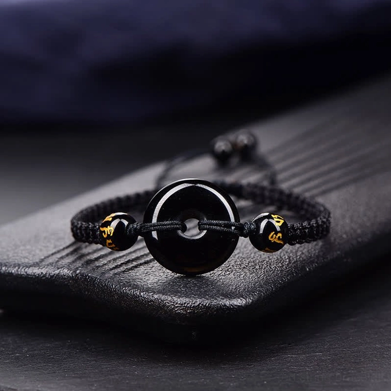 Black Obsidian Peace Buckle bracelet with black braided cord detailed view
