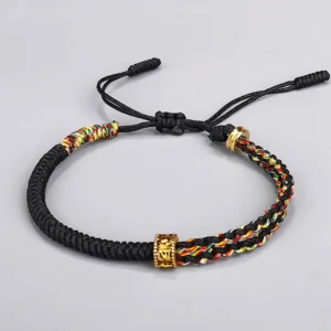 Om Mani Padme Hum black red string protection bracelet with colorful chakra beads - flat lay view