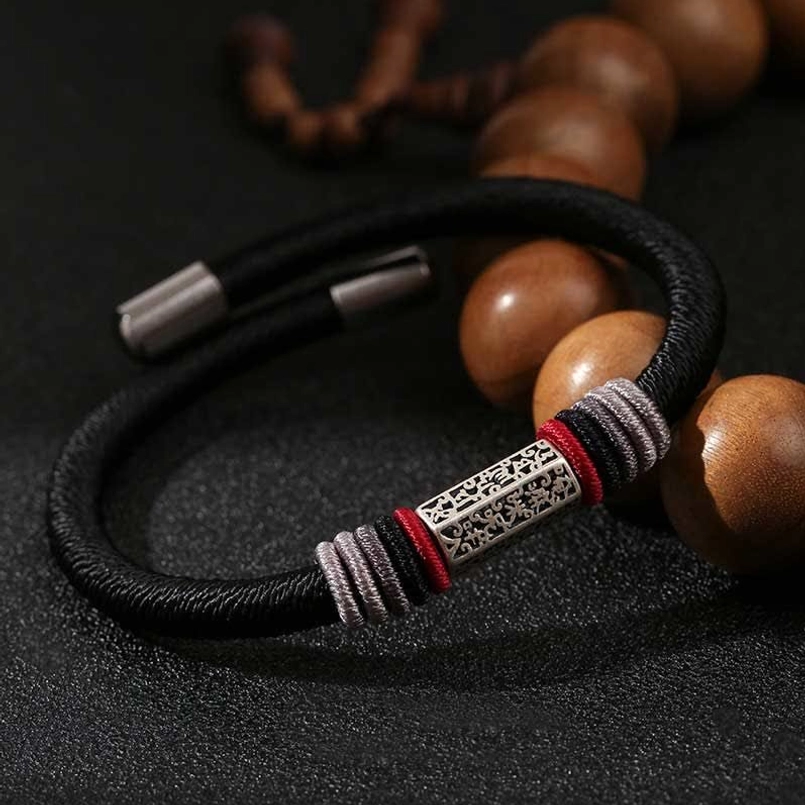 Black Om Mani Padme Hum cord bracelet with 925 sterling silver engraved charm, full product view