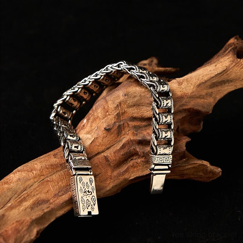 Tibetan copper mantra bracelet hanging display showing magnetic clasp