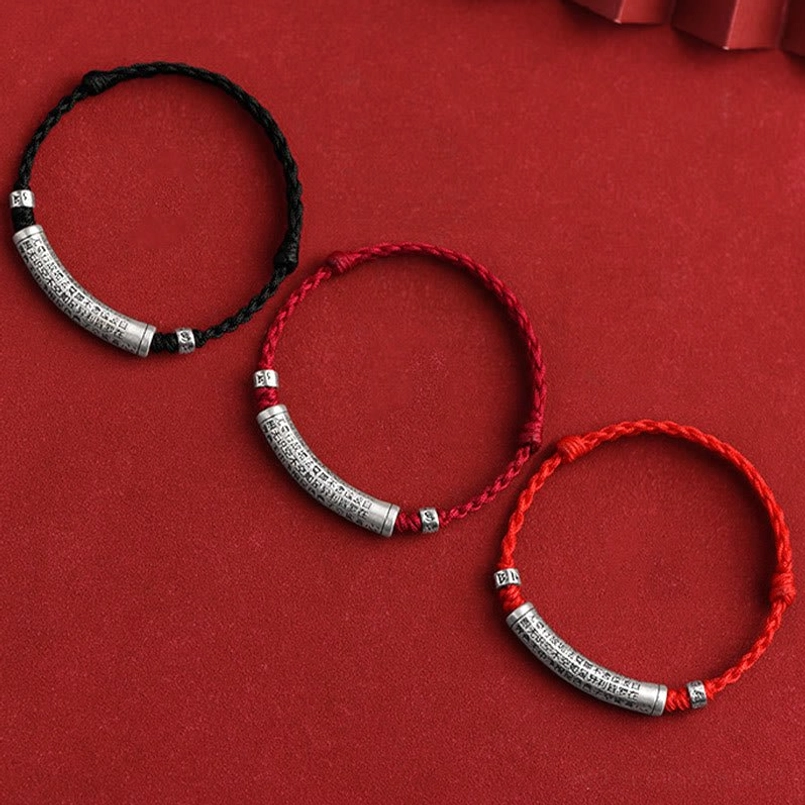 Buddhist red string bracelet collection showing multiple color options with engraved silver sutra pendant