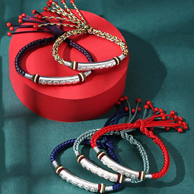 Om Mani Padme Hum handmade red string bracelet with pure silver tube accent