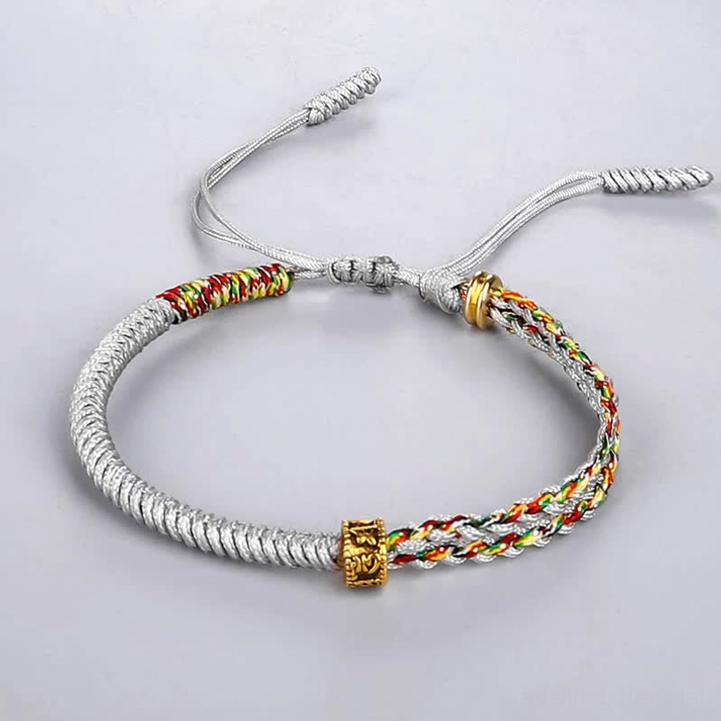 Om Mani Padme Hum gray silver white string bracelet with colorful woven section - flat lay