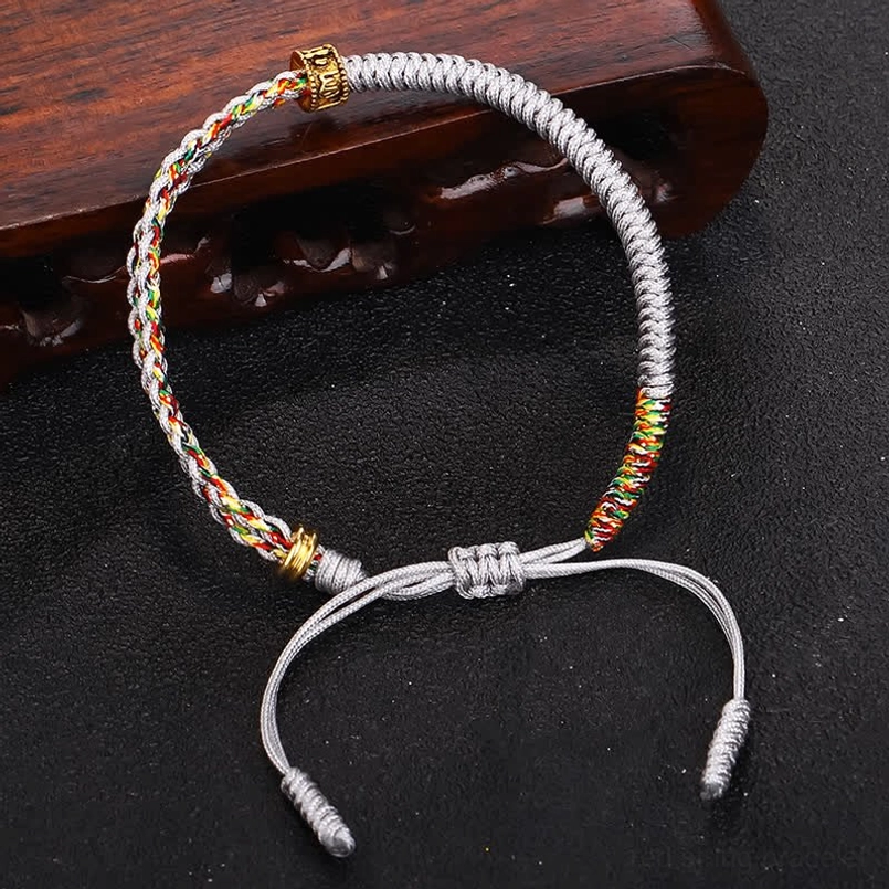 Om Mani Padme Hum gray silver protection bracelet with gold hardware - side view display