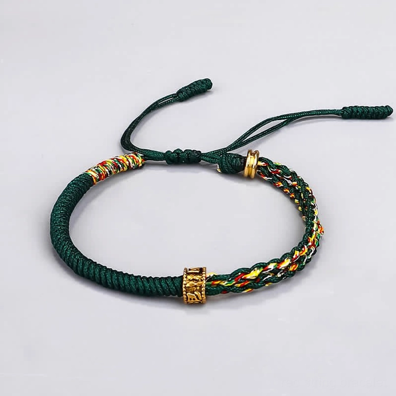 Om Mani Padme Hum green string bracelet with chakra beads and adjustable knot - flat lay