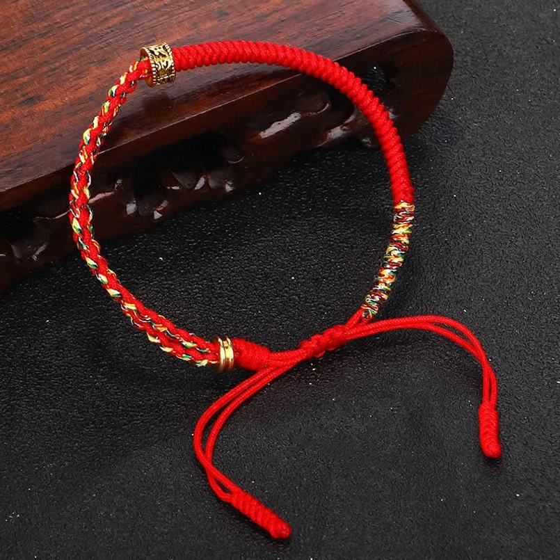 Om Mani Padme Hum red protection bracelet with adjustable pull cord closure - side profile
