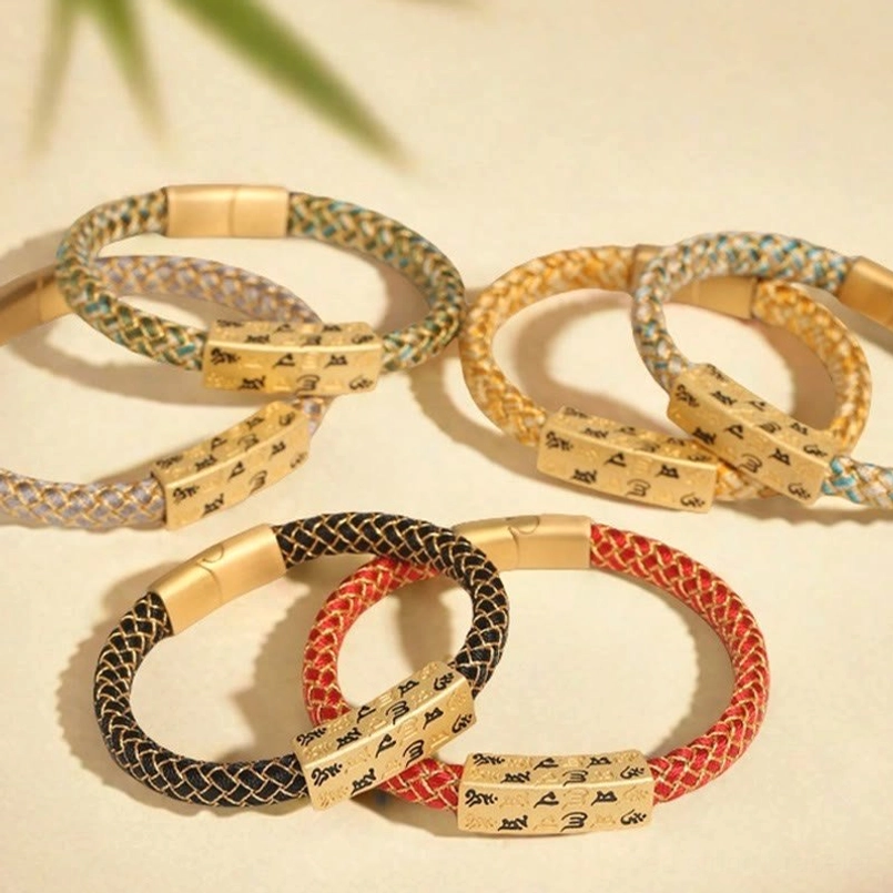 Om Mani Padme Hum Tibetan bracelet showing multiple color options with gold accents on studio background