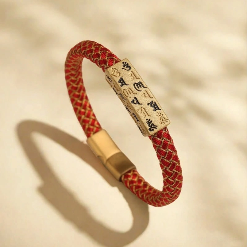 Overhead view of Om Mani Padme Hum Tibetan bracelet displaying full rope design and rectangular magnetic clasp