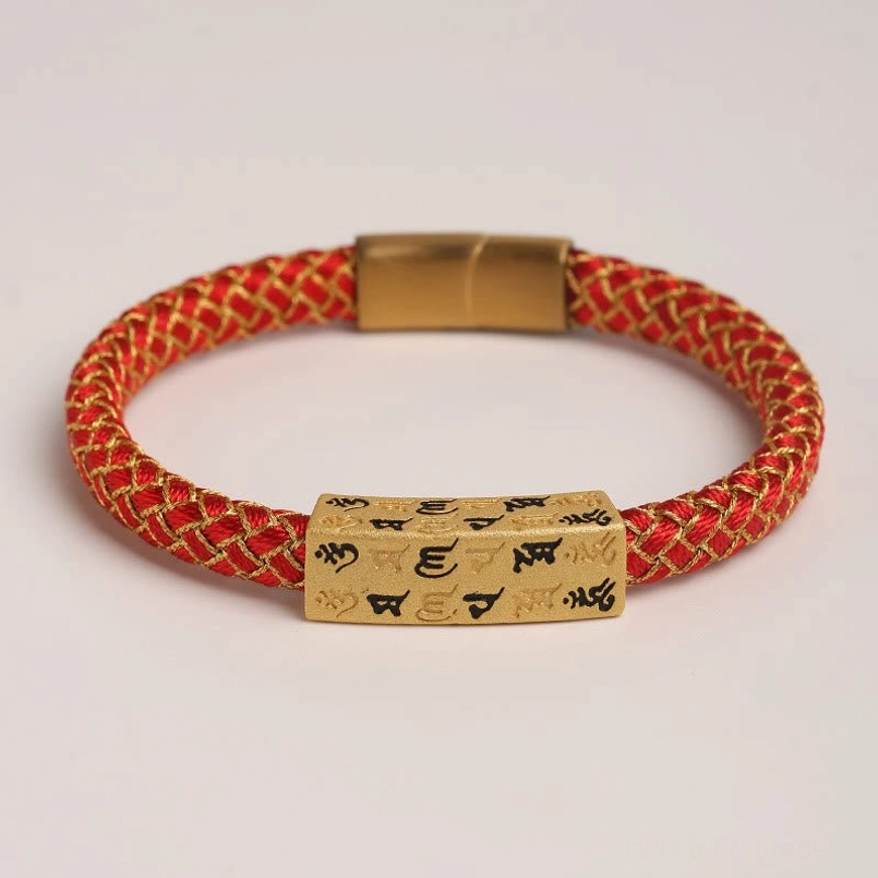 Flat lay view of red Om Mani Padme Hum Tibetan bracelet with magnetic gold clasp and rectangular mantra charm
