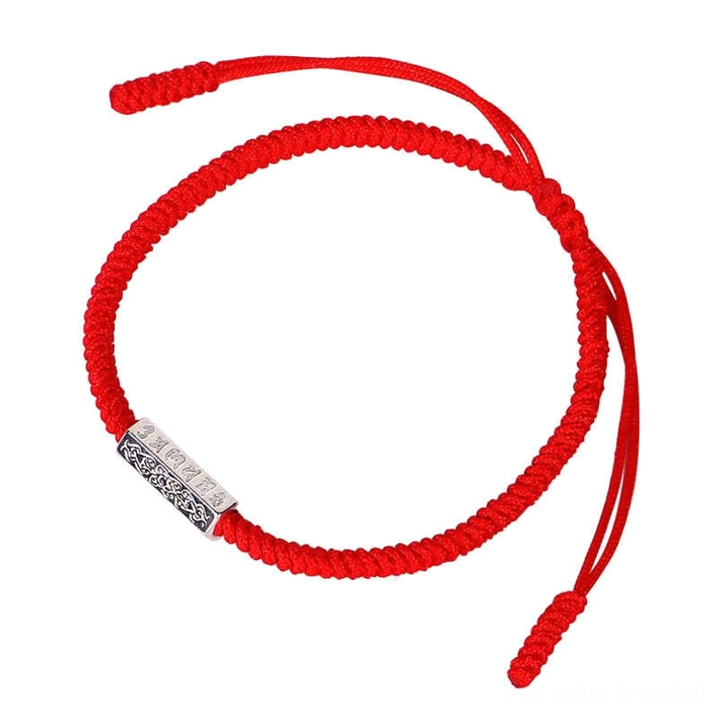 Om Mani Padme Hum red string bracelet close-up showing braided cord and silver charm detail