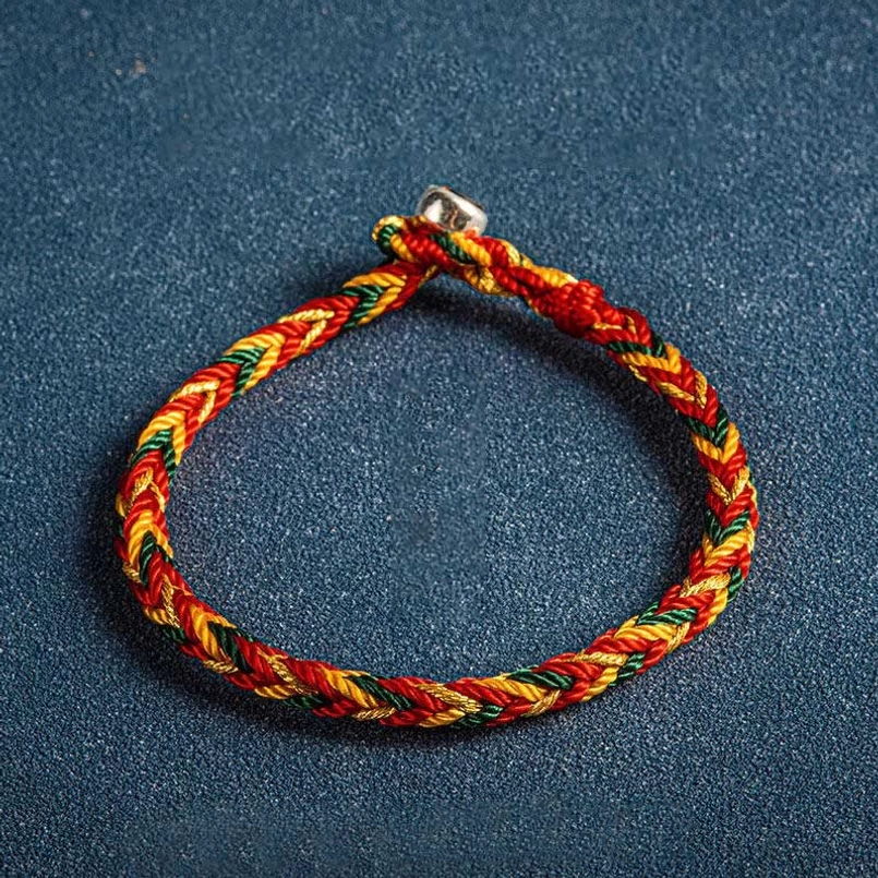 Orange dark green red multicolor string bracelet featuring woven design and sterling silver King Kong knot clasp for protection and good fortune