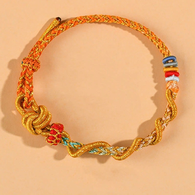 Orange dimple knot luck bracelet – vibrant Year of the Snake fortune charm