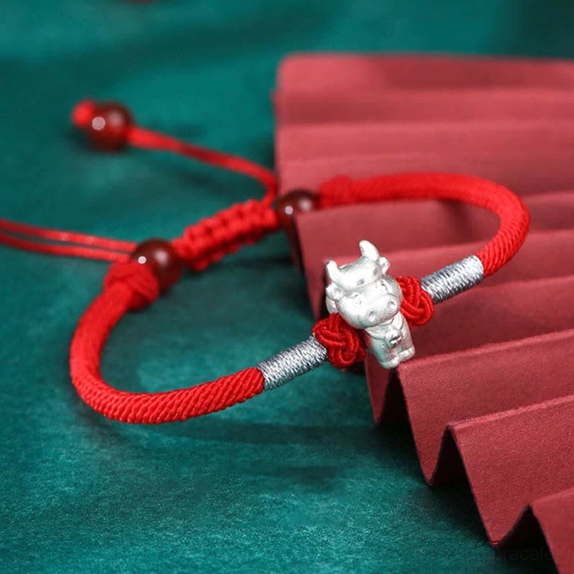 Sterling silver zodiac ox charm red string bracelet with red agate beads and braided rope detail
