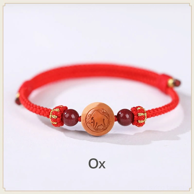 Ox zodiac peach wood prosperity bracelet featuring ox carved charm and red knot decorations - luck bracelet
