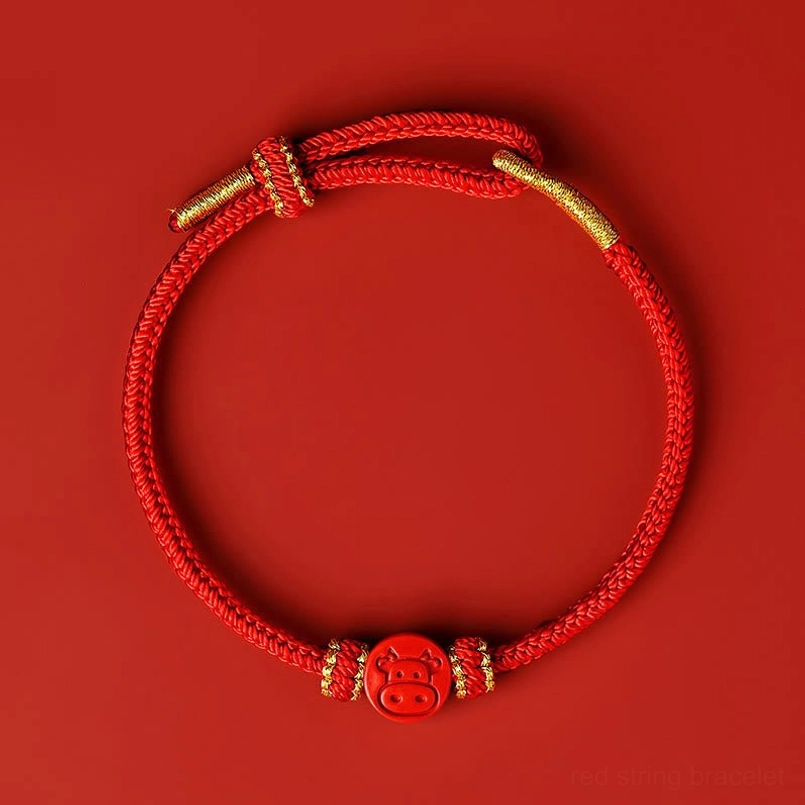 Ox zodiac red string luck bracelet with hand-carved cinnabar pendant