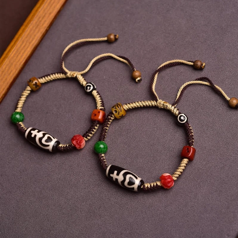 Two Matching Tibetan Dzi Bead Protection Bracelets Flat Lay