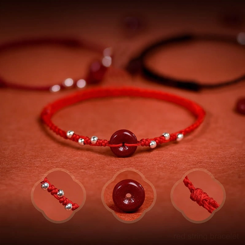 Cinnabar peace buckle bracelet set multiple pieces overhead flat lay on red textile