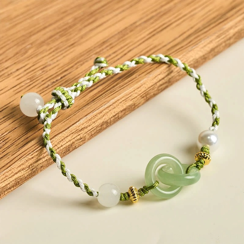 Green white peace buckle braided bracelet overhead three quarter view jade bead