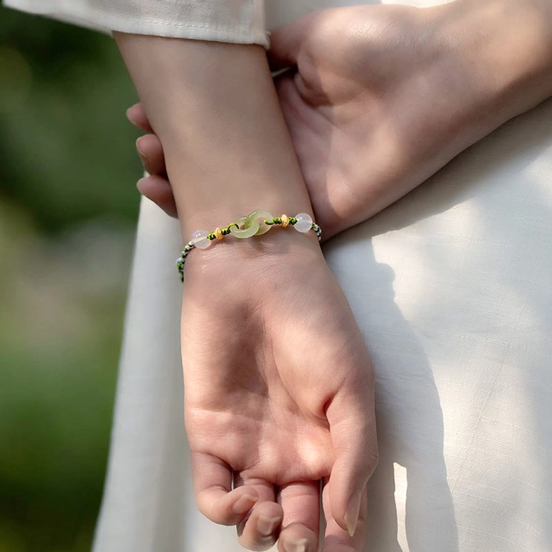 Peace buckle bracelet worn on hands lifestyle close-up natural daylight setting