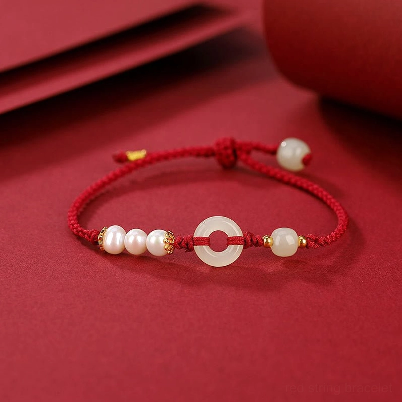 Peace buckle pearl red string bracelet top down view with three pearls