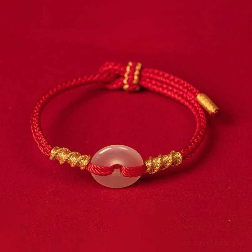 Red braided peace buckle bracelet with gold end caps and translucent chalcedony stone, back view