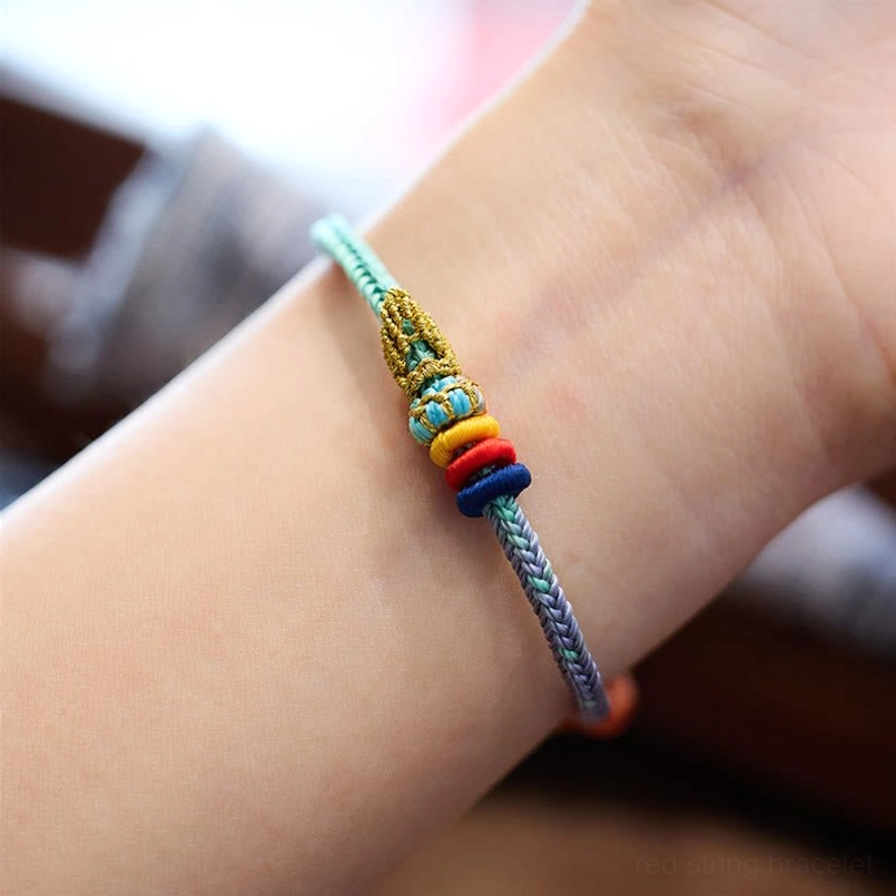 Worn eight thread peace knot bracelet on wrist showing multicolor design and comfortable fit