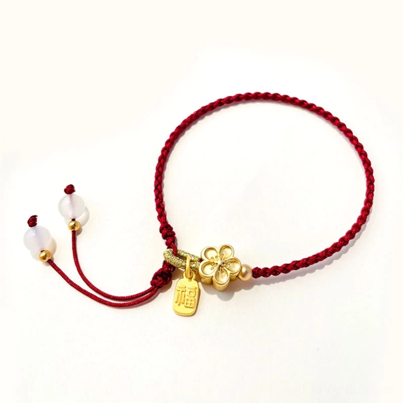 Peach blossom red string Fu bracelet with gold four-leaf flower charm and adjustable white bead tassel