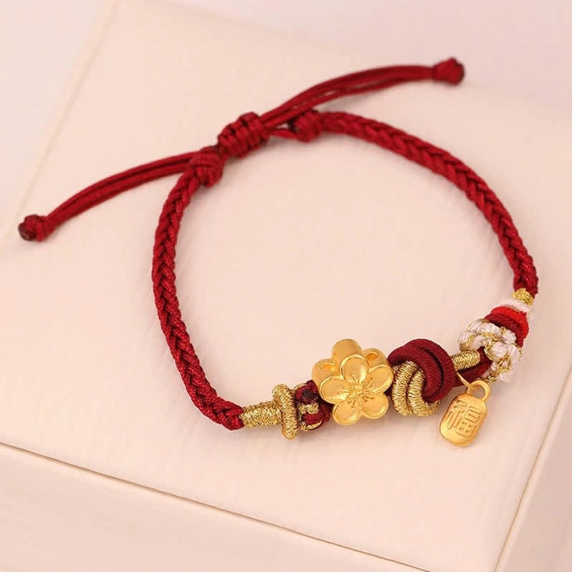Peach blossom red string bracelet flat lay on white background showing fu character pendant