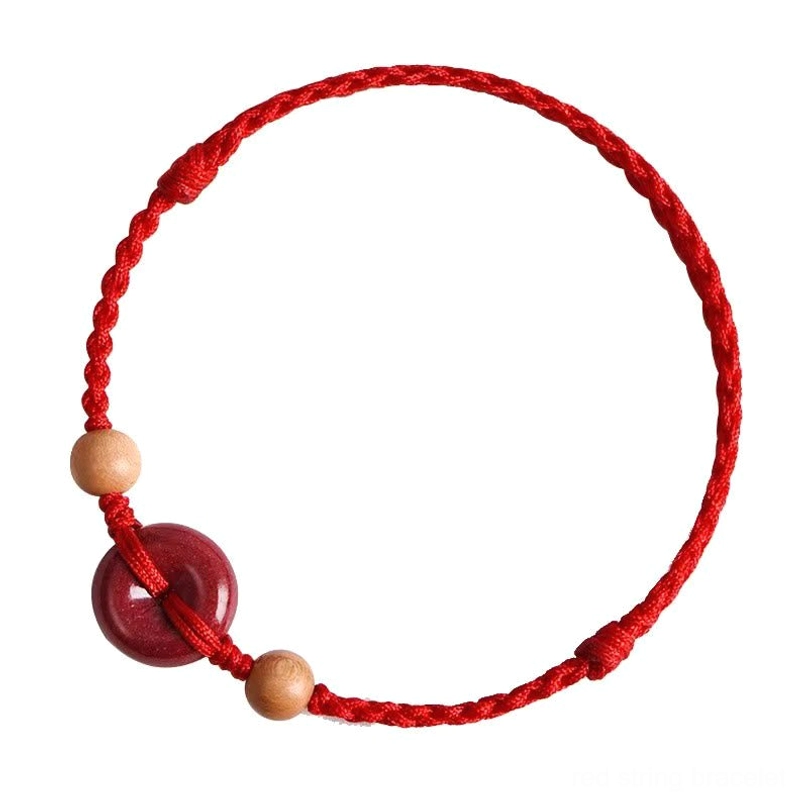 Red string peach wood bracelet product display on white background