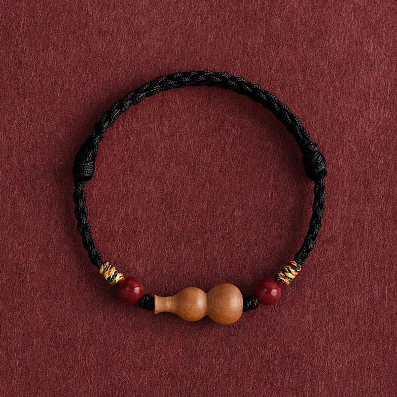 Black braided rope bracelet variant with gourd charm and cinnabar accents