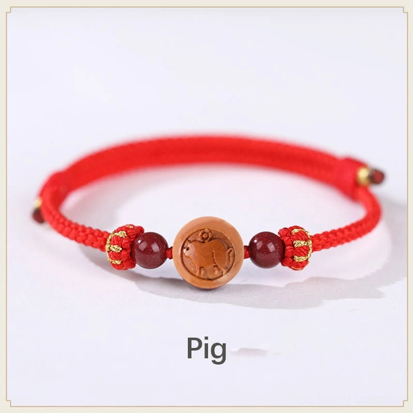 Pig zodiac peach wood bracelet with red rope - compassion and generosity fortune bracelet