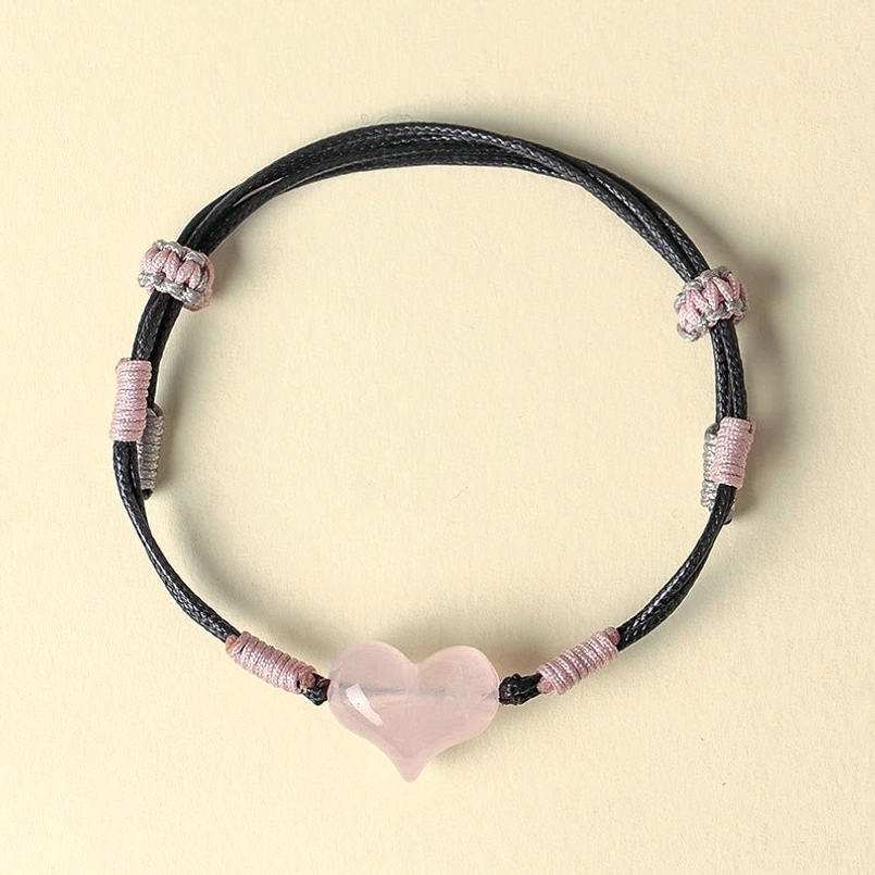 Pink crystal heart braided bracelet with silver accents top down