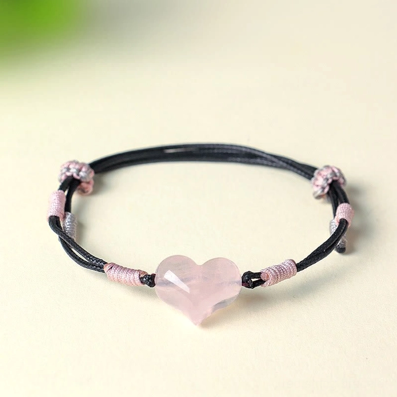Pink crystal heart charm bracelet front view with adjustable knots