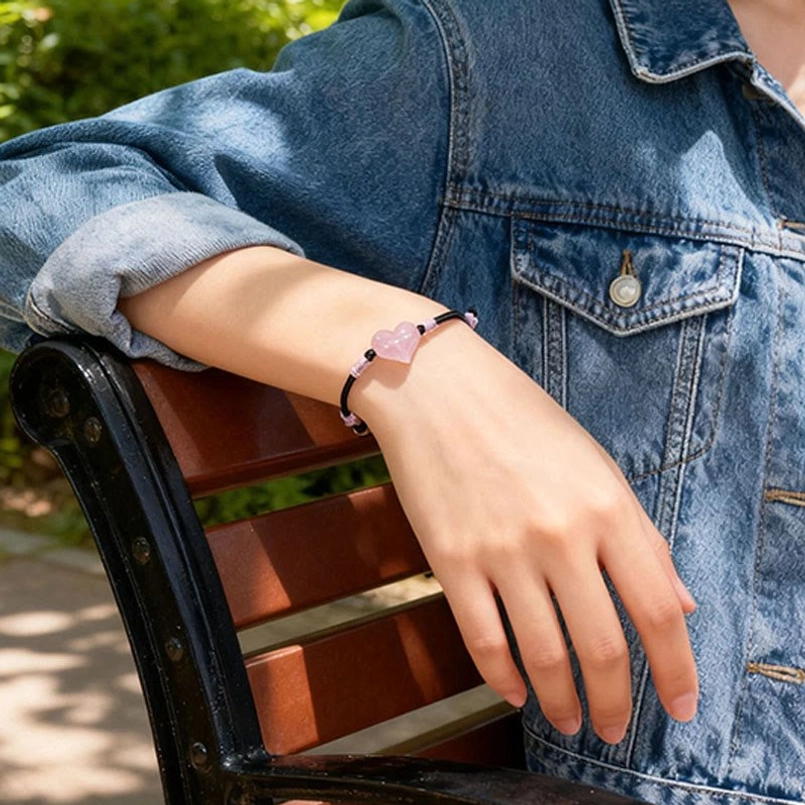 Pink crystal heart adjustable bracelet with woven black rope knots