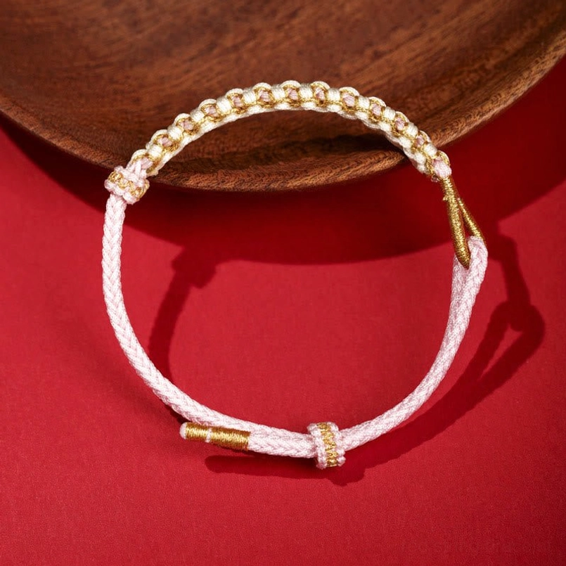 Pink Tibetan peach blossom knot braided red string bracelet with adjustable knot