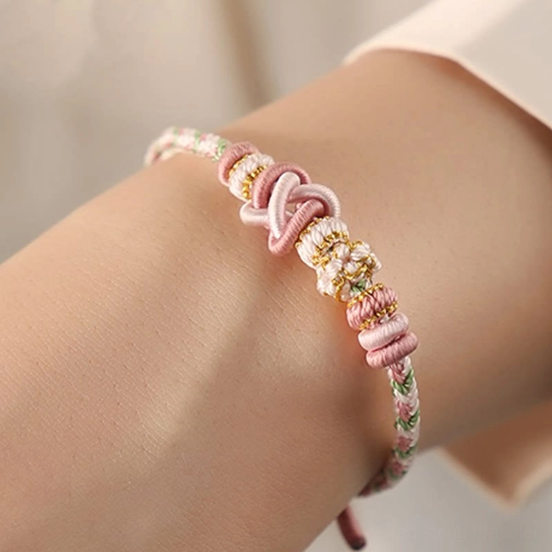 Pink Red String Luck Bracelet Worn On Wrist On Model Display
