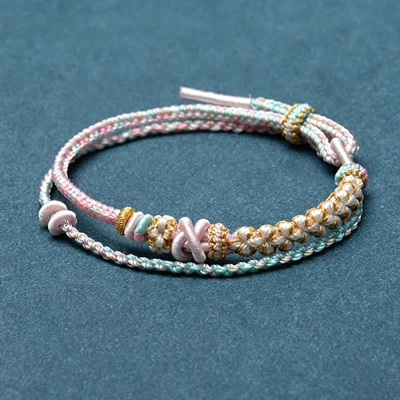 Pink woven string bracelet no accessory minimalist design flat lay