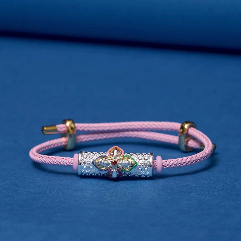 Pink string protection bracelet with multiple color flower enamel charm
