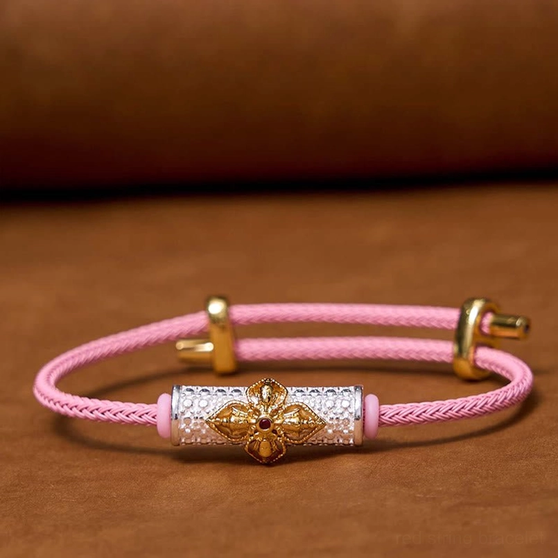 Pink string protection bracelet with silver gold flower and precious metal accents