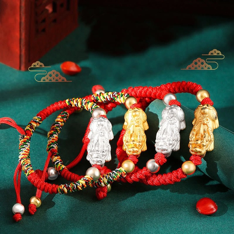 Adjustable Pixiu kids bracelet with sliding knot showing expandable fit for children