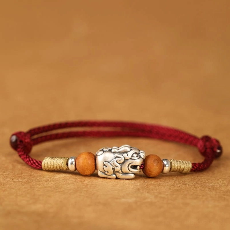 Darkred String Pixiu Bracelet with Sterling Silver Charm - Side Flat Lay