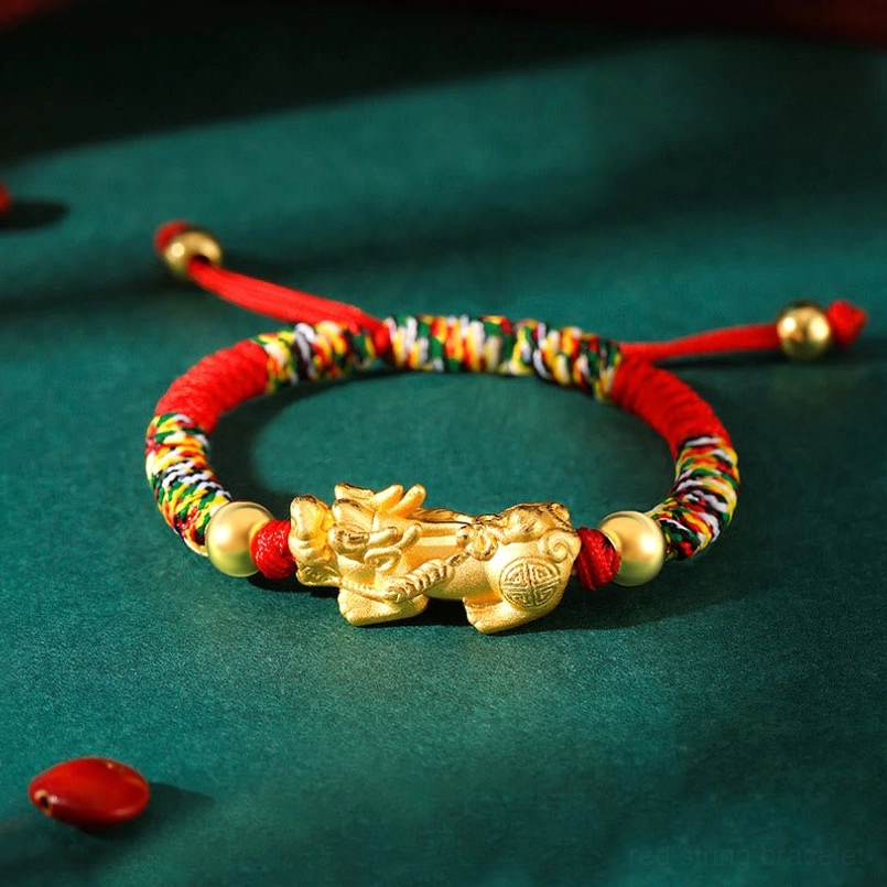 Sterling Silver Pixiu charm kids bracelet flat lay showing dual pull knots and gold beads