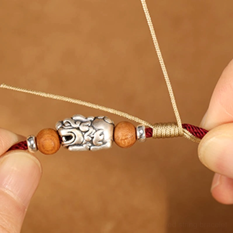Handmade Pixiu Bracelet Crafting Process - Threading Silver Charms Through Cord