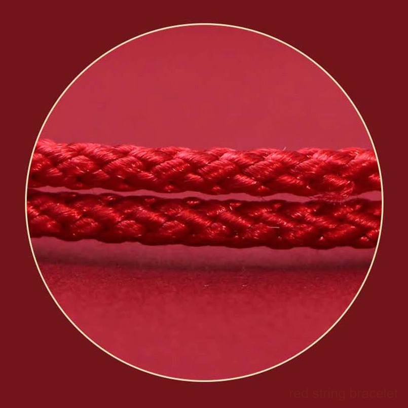 Close-up macro view of braided rope texture on Pixiu wealth bracelet