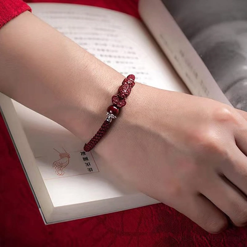 Sterling silver clasp on adjustable red braided Pixiu cinnabar bracelet