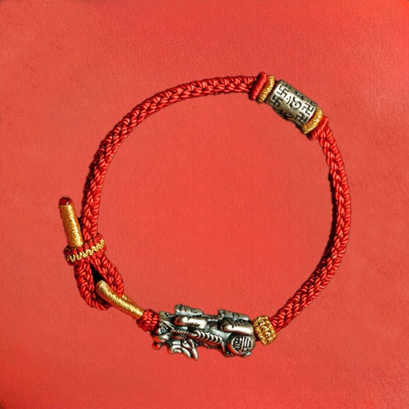 Pixiu om mani padme hum red string bracelet close-up detail showing intricate silver engraving
